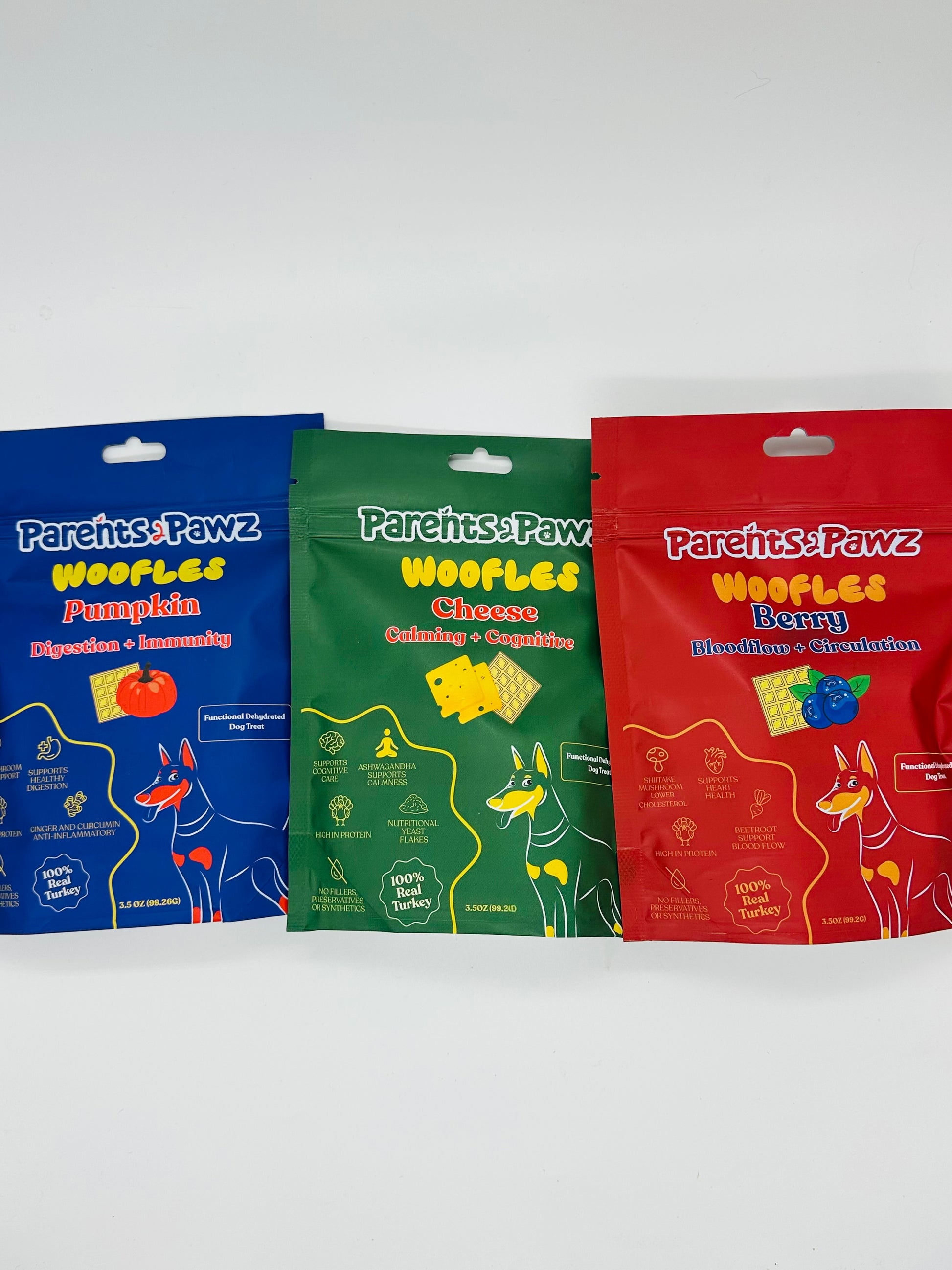 Three packages of Pawesome Treats on a white background