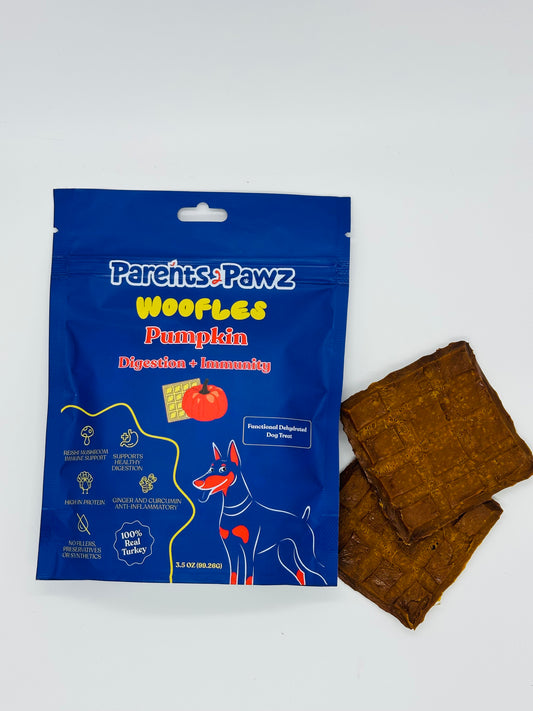 Blue package of 'Parents Pawz Woofles Pumpkin' dog treats on a white background